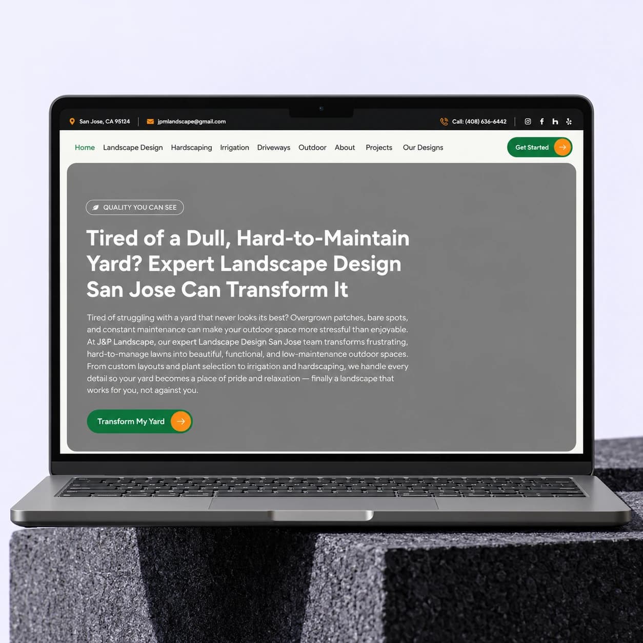 J&P Landscape website displayed on a laptop