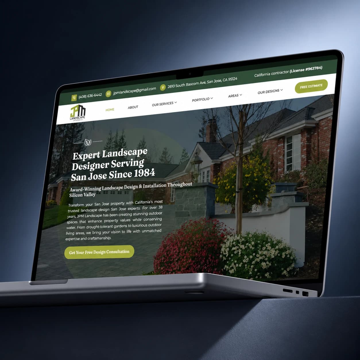 JPM Landscape website displayed on a laptop